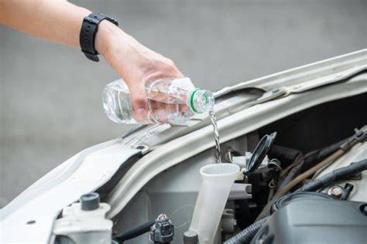 Can I use water as coolant in my car?