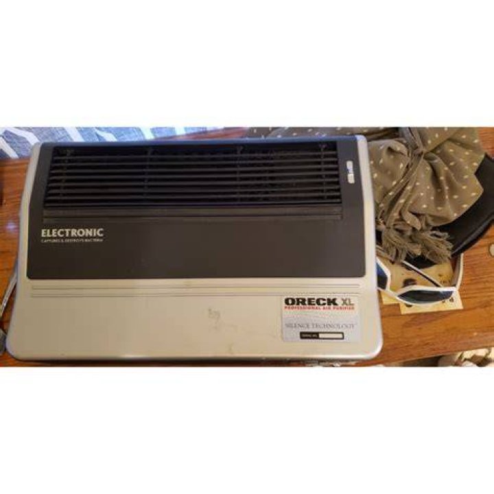 How do I clean my Oreck XL Professional Air Purifier?