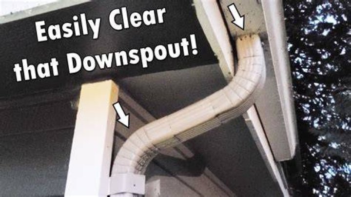 How do you unclog a downspout drain?